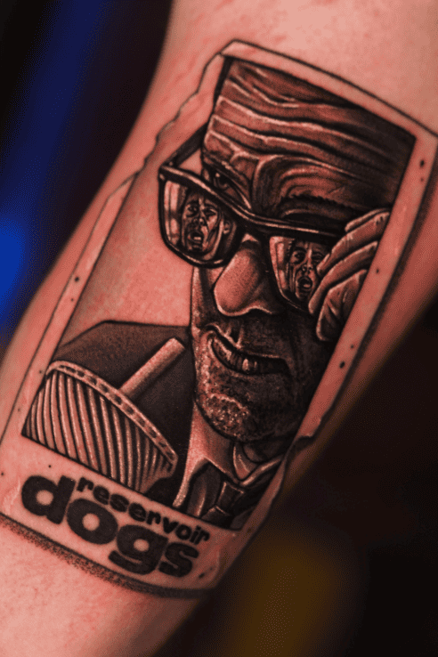 Reservoir Dogs poster portrait, black and grey realism forearm tattoo