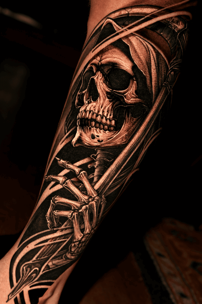 Hooded reaper skull with a scythe and skeletal hand, black and grey realism forearm sleeve
